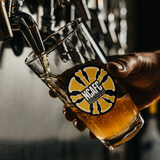 NCAFC_Pint_Glass_Pint_Glass_Dark_Lifestyle_Mockup.png_15588058