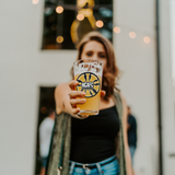 NCAFC_Pint_Glass_Pint_Glass_Model_Lifestyle_Mockup.png_15588059